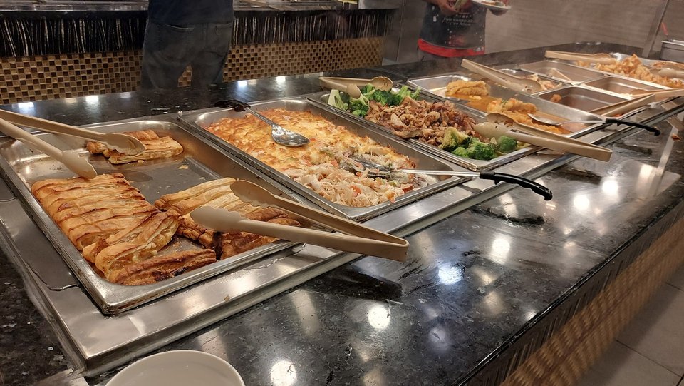 Casual restaurant dining area with buffet stations